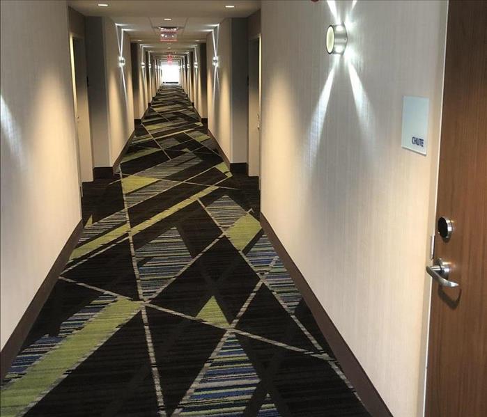 water damaged hotel hallway before demolition