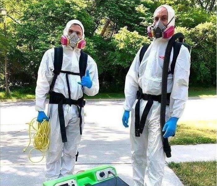 SERVPRO of Marshalltown staff in disinfecting PPE