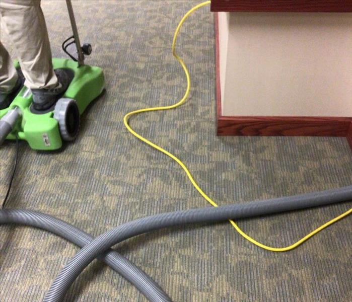 Riding water extractor on carpet