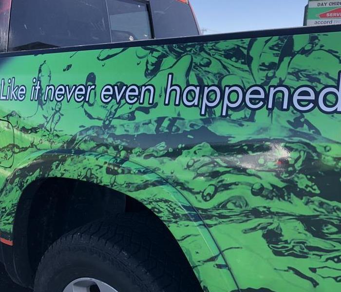 SERVPRO logo on side of truck: "Like it never even happened."
